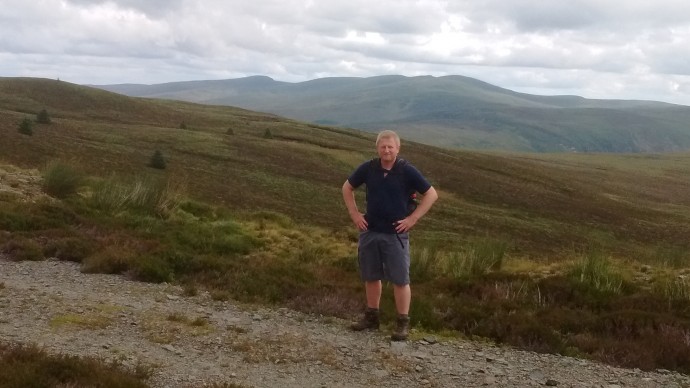Darryl with Moel Sych Cadair Berwyn and Cadair Bronwyn in background