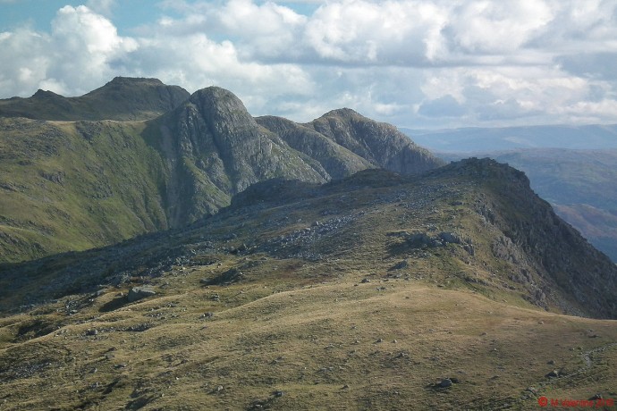 The view across Rossett Pike to Pike of Stickle and the Langdale Pikes.