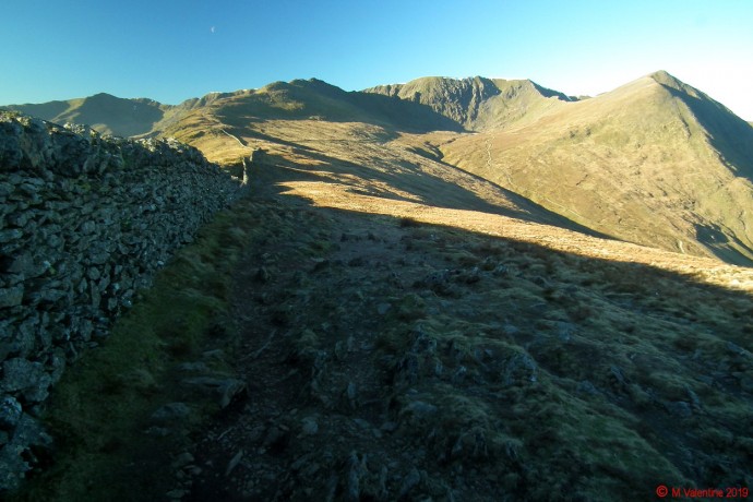 Looking along the wall.