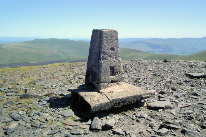 Skiddaw trig pillar with Blencathra in the distance.