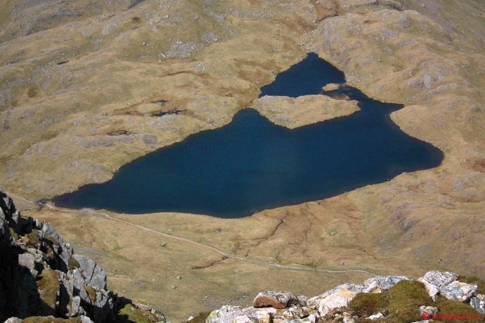 Looking down to Sprinkling Tarn from Great End summit plateau.